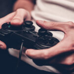 Man,Playing,On,The,Joystick,In,A,Game,Console