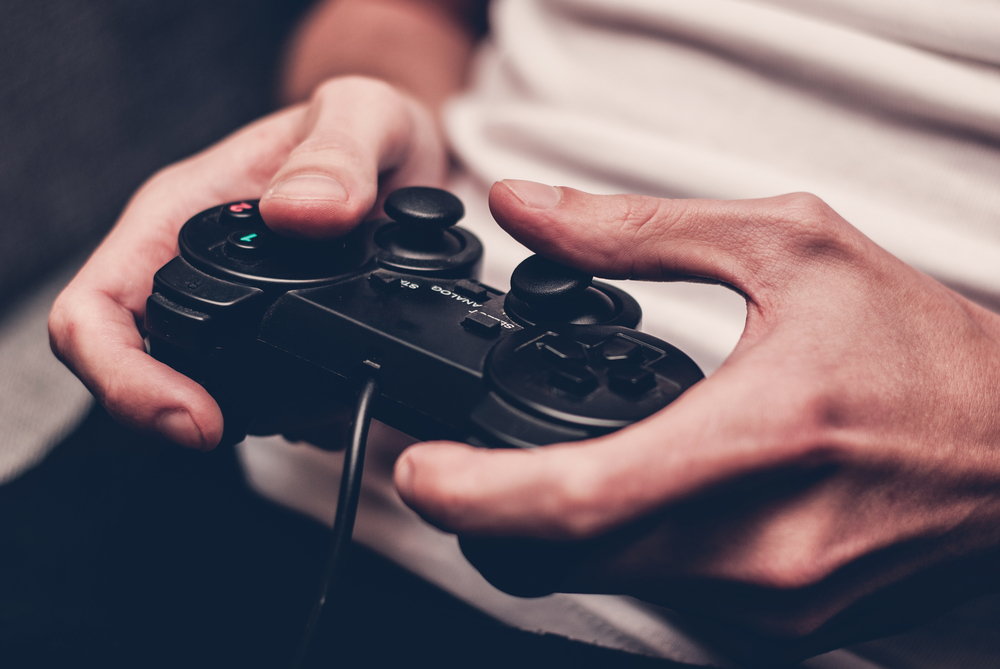 Man,Playing,On,The,Joystick,In,A,Game,Console