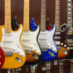 Assortment,Of,Colorful,Electric,Guitars,On,Display,In,A,Pawn