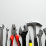 Set,Of,Tools,On,Gray,Background,,Top,View